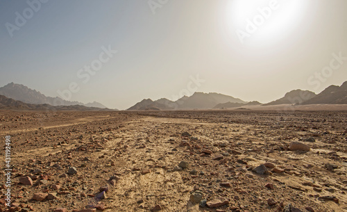 Barren rocky desert landscape in hot climate