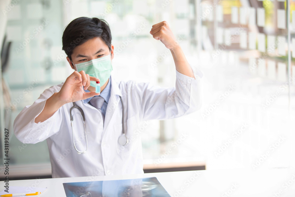 The doctor is testing a sample of biological tubes contaminated by Corona-virus Covid 19 and searching for a vaccine or Syrup against the virus. In the laboratory and film samples of infected lung The doctor is testing a sample of biological tubes contaminated by Corona-virus Covid 19 and searching for a vaccine or Syrup against the virus. In the laboratory and film samples of infected lung