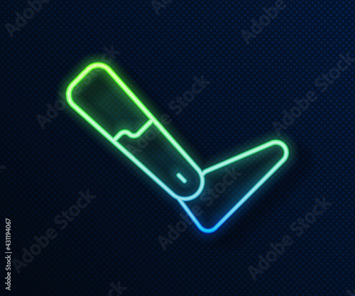 Glowing neon line Prosthesis leg icon isolated on blue background. Futuristic concept of bionic leg, robotic mechanical leg. Vector
