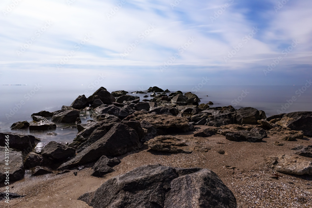 View of the sea on a moonlit night made with long exposure. Ochakov. Ukraine