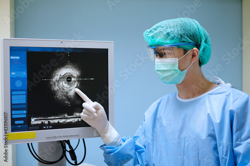 doctor used Intravascular ultrasound imaging (IVUS) machine at cardiac catheterization laboratory room photo