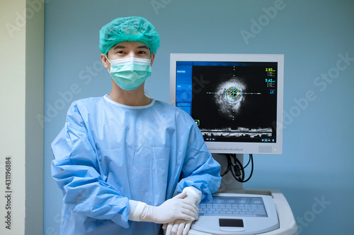 Photos Doctor wears sterile uniform and uses Intravascular ultrasound imaging (IVUS) ma