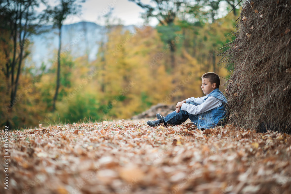 boy sitting outside boy sitting outside