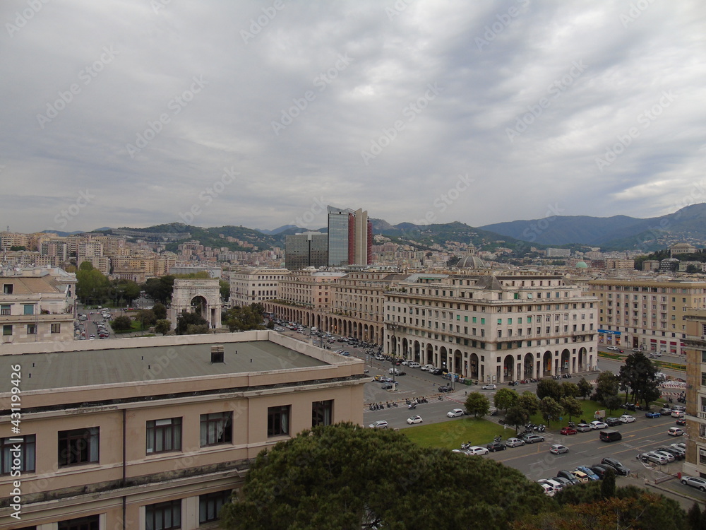 Genova, Italy - April 26, 2021: Modern construction in the city center of Genova, beautiful high skylines with grey and blue sky in the background in spring.
