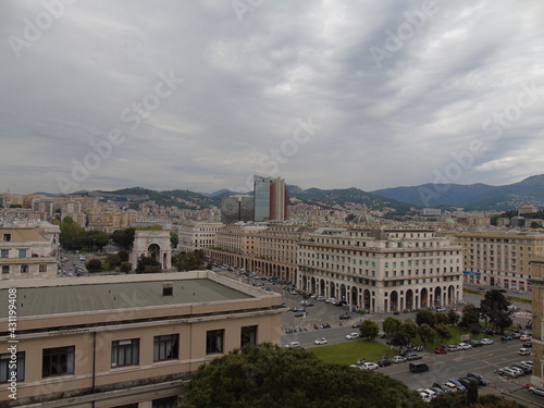 Genova, Italy - April 26, 2021: Modern construction in the city center of Genova, beautiful high skylines with grey and blue sky in the background in spring. © yohananegusse