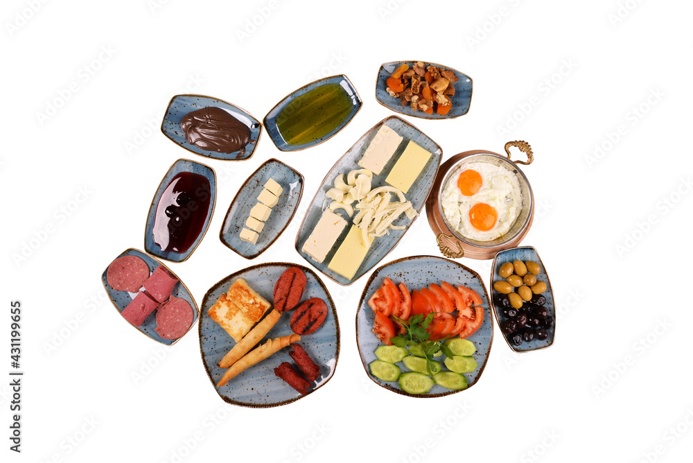 Traditional Turkish Village Breakfast on the white background. eggs, cheeses, sausages, salami, jams, fried pastries, eggs, olives, salads (serpme kahvalti) rich breakfast top view