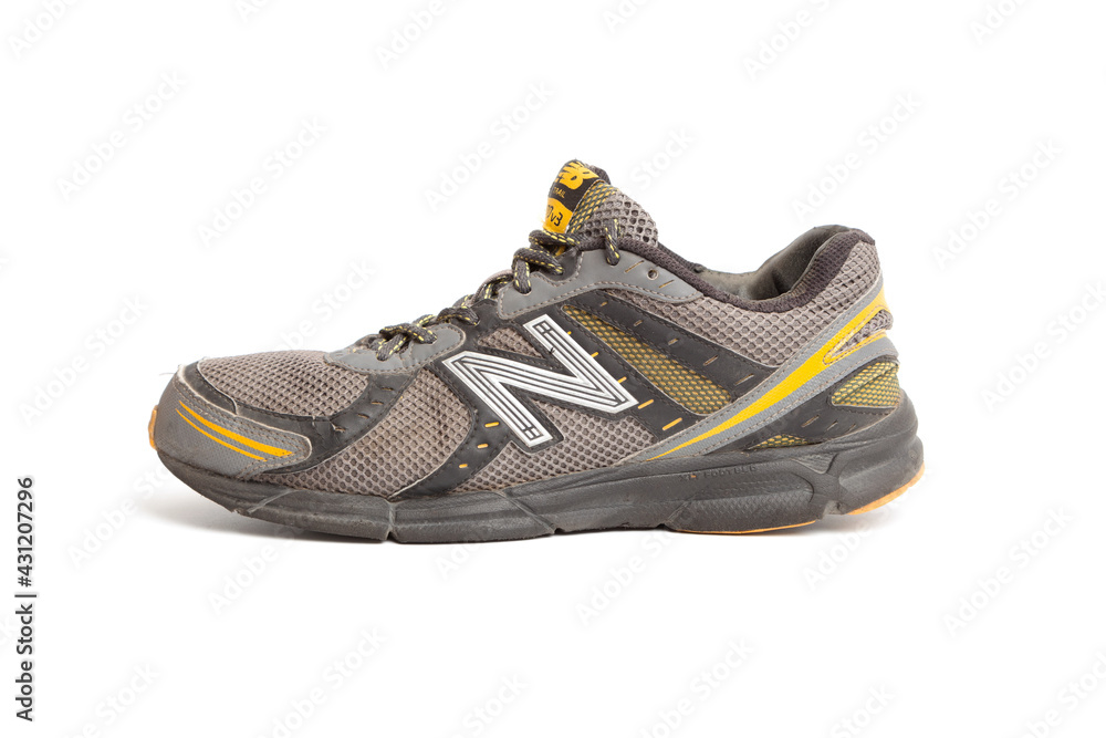 Dirty old New Balance 470 v3 running trainers with holes in on a white  background Stock Photo | Adobe Stock