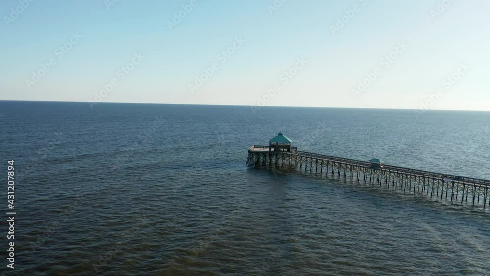 Aerial view of peaceful dock and kiosk above the calm sea Aerial view of peaceful dock and kiosk above the calm sea