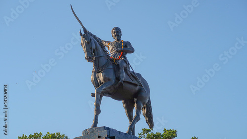 Statue of Chhatrapati Shivaji Maharaj on horseback riding a horse with raised sword Pratapgad, Maharashtra, India photo