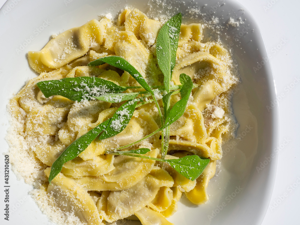 Casoncelli is a kind of ravioli, home made traditional food of the Bergamo area, Italy. Delicious Italian food. Simple food with ancient traditions. Casoncelli cooked served with parmesan cheese Casoncelli is a kind of ravioli, home made traditional food of the Bergamo area, Italy. Delicious Italian food. Simple food with ancient traditions. Casoncelli cooked served with parmesan cheese