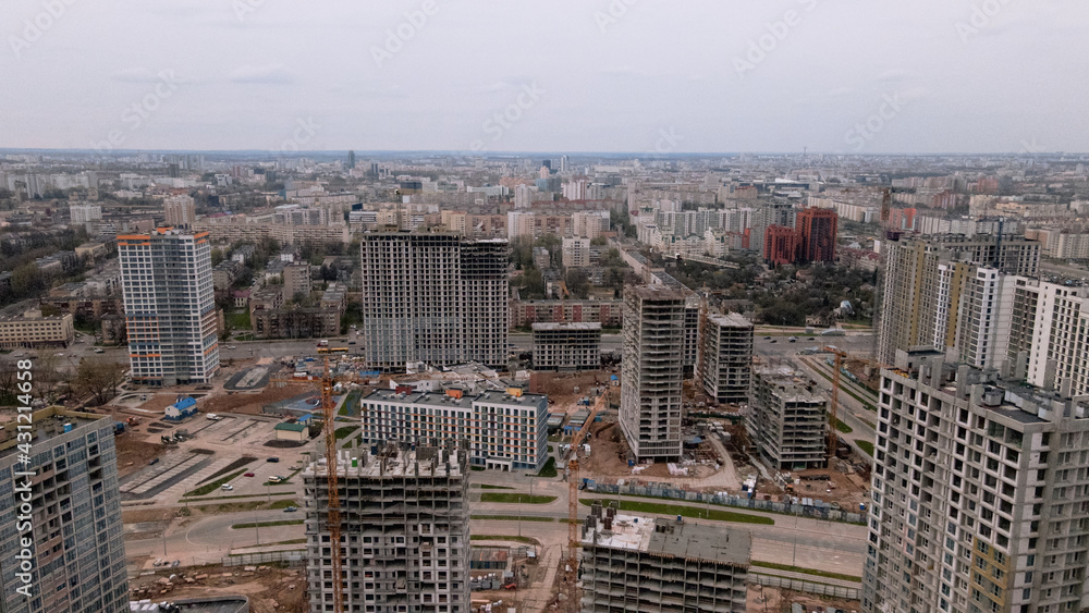 Construction site with multi-storey buildings under construction. Modern urban development. Aerial photography.