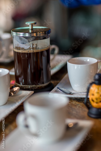 French Press Coffee Maker. Morning concept. coffee siphon. Spent coffee break at the organic cafe and prepare Chocolate or tea in French press.