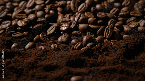Close up of Brown Arabica Coffee Beans with coffee powder