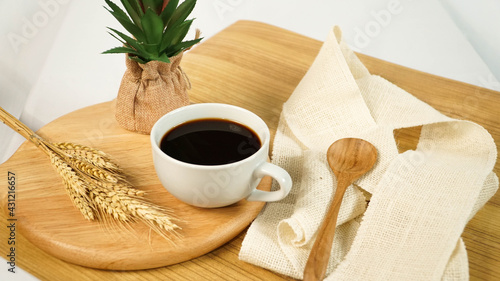 Fresh Hot Black Coffee on wooden table with home decoration