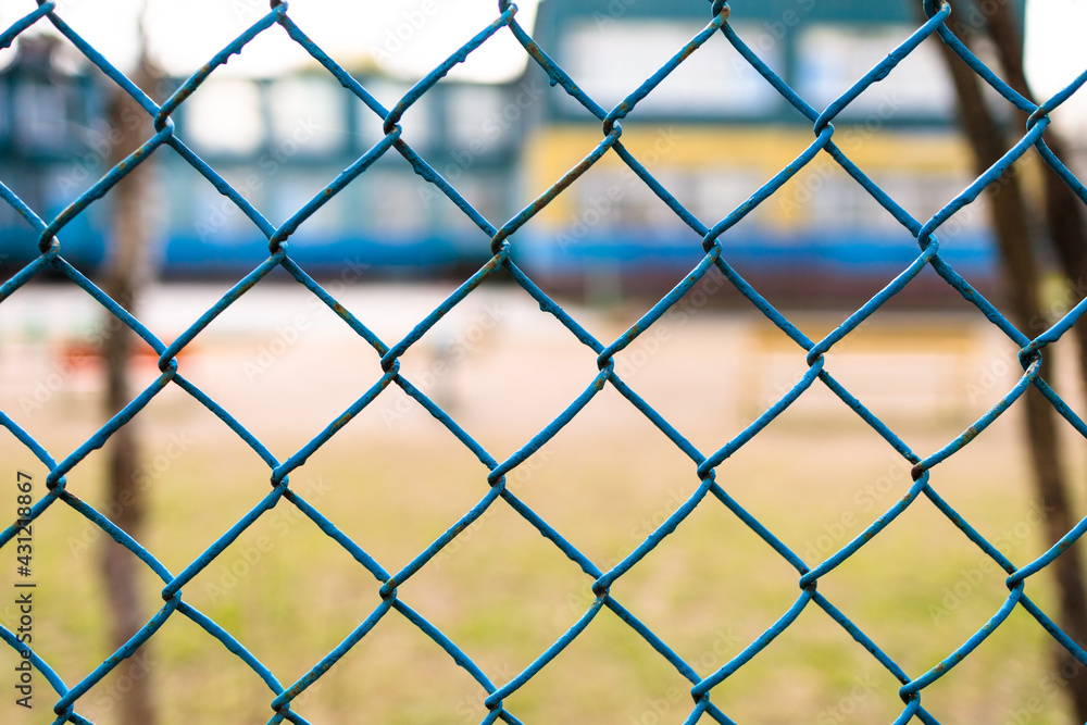 chain-link of blue color close-up, background is blured chain-link of blue color close-up, background is blured