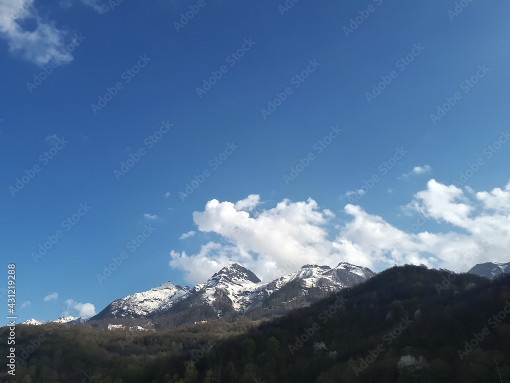 the mountains are visible in the snow