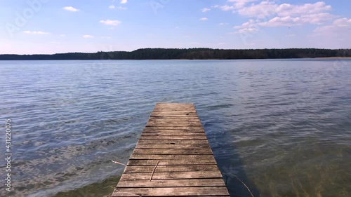 Wallpaper Mural Wooden pier beside a picturesque lake.Soft wave on. the surface of the water in the lake. Torontodigital.ca