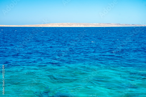 Beautiful seascape of the Egyptian coast, Red Sea, horizon, colorful water, calm.