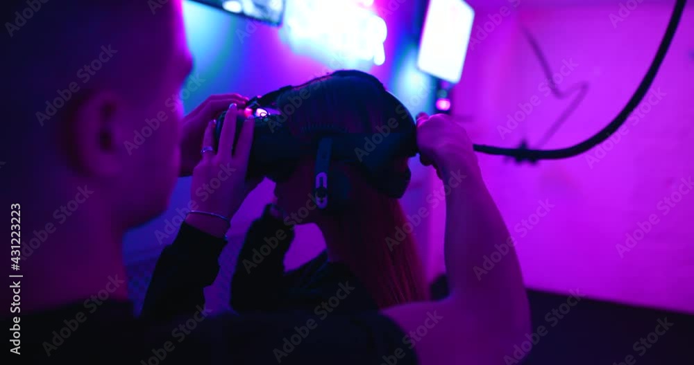 A young woman is connected to virtual reality. A young woman is connected to virtual reality.