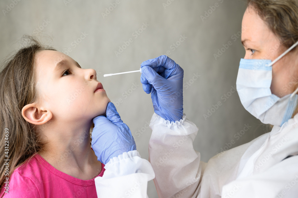 COVID-19 PCR test and kid, nurse holds swab for nasal sample from adorable  child Stock-Foto | Adobe Stock