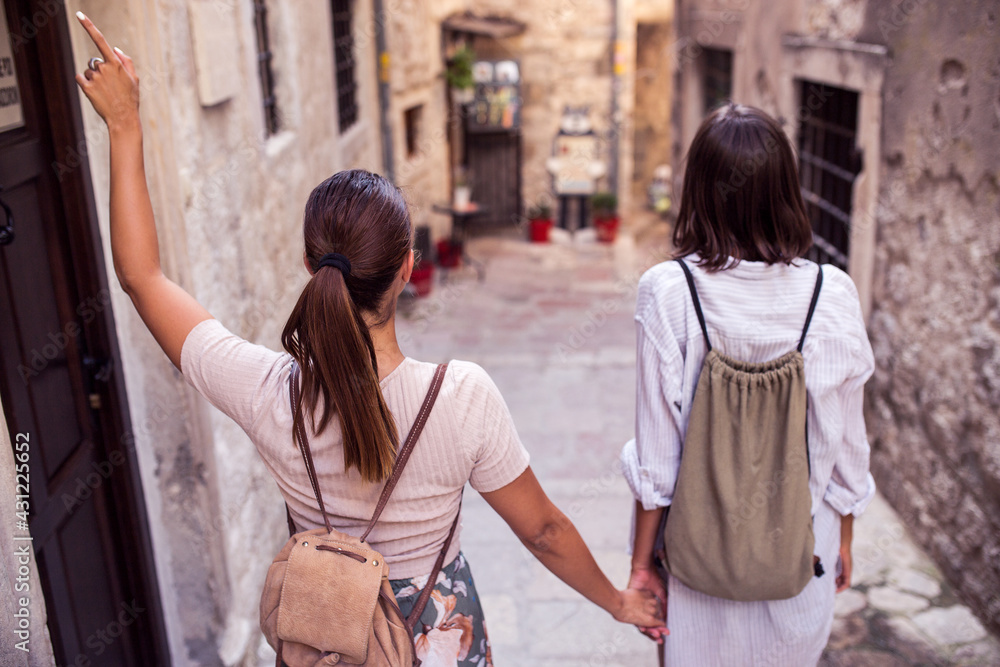Hipster female tourist walking at town Hipster female tourist walking at town