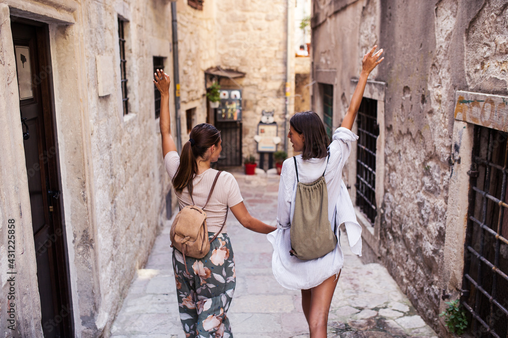 Hipster female tourist walking at town Hipster female tourist walking at town