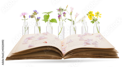 Bottles with Bach Flower Stock Remedy and book. CONCEPT © MAXSHOT_PL