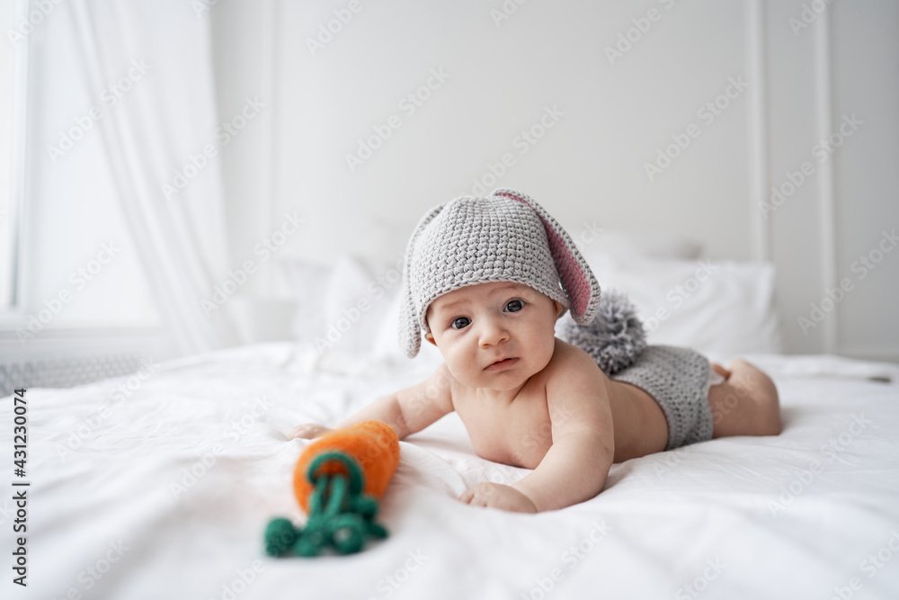happy baby child in costume a rabbit bunny on a white background. High quality photo happy baby child in costume a rabbit bunny on a white background. High quality photo