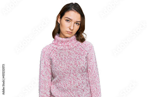 Young caucasian girl wearing wool winter sweater looking sleepy and tired, exhausted for fatigue and hangover, lazy eyes in the morning. © Krakenimages.com