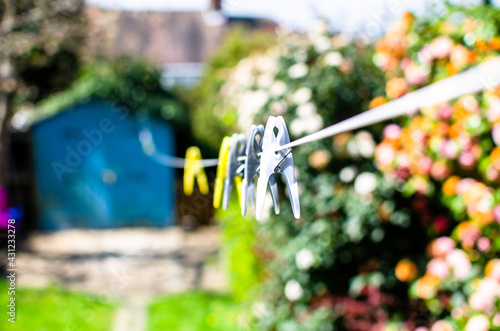 Selective focus of pegs on washing line 
