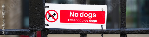 No dogs except guide dogs sign outside school