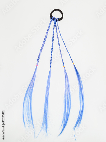 Children's hair ornaments. Blue pigtails on a white background. © Sergei Dvornikov
