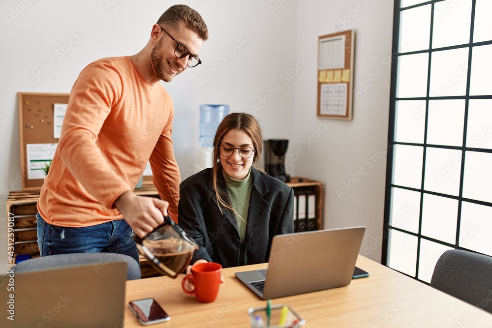 Two caucasian business executives working and drinking coffee at the office. Two caucasian business executives working and drinking coffee at the office.