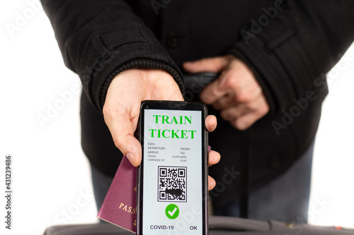 traveller with covid train ticket and passport