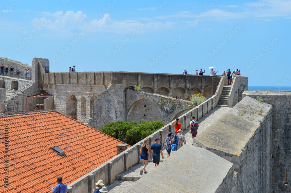 Walking on walls of town Dubrovnik on June 18, 2019. 