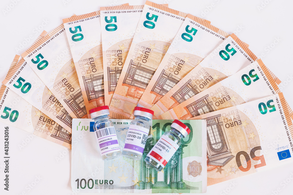 Three different vaccines to fight the coronavirus pandemic. The huge amount of money the European Union is spending. Euro banknotes, business with vaccines. Concept of treatment and cost. Three different vaccines to fight the coronavirus pandemic. The huge amount of money the European Union is spending. Euro banknotes, business with vaccines. Concept of treatment and cost.