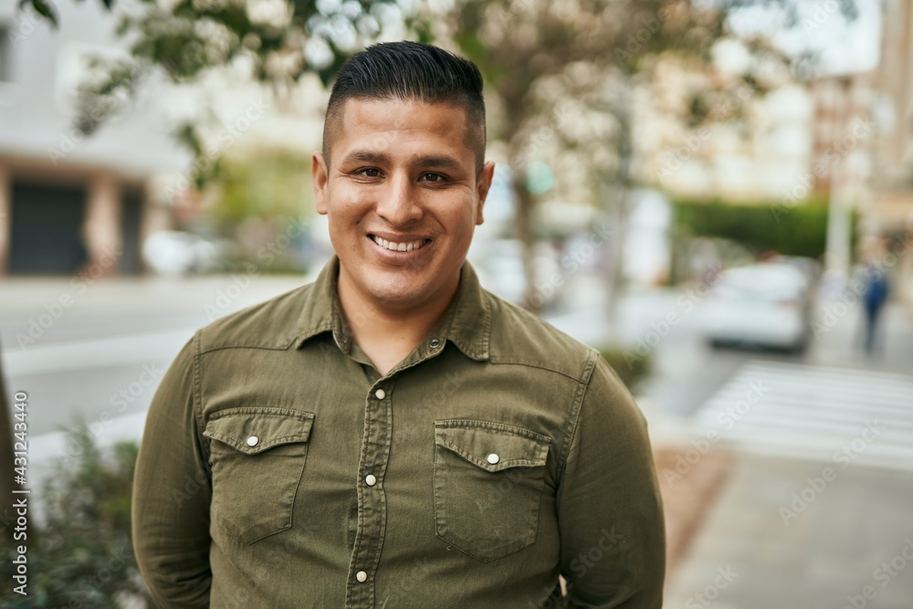 © Krakenimages.com - Young latin man smiling happy standing at the city. © Krakenimages.com - Young latin man smiling happy standing at the city.