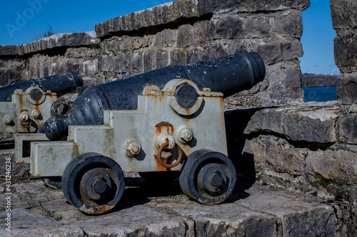 Beautiful view of the old cannons by wall