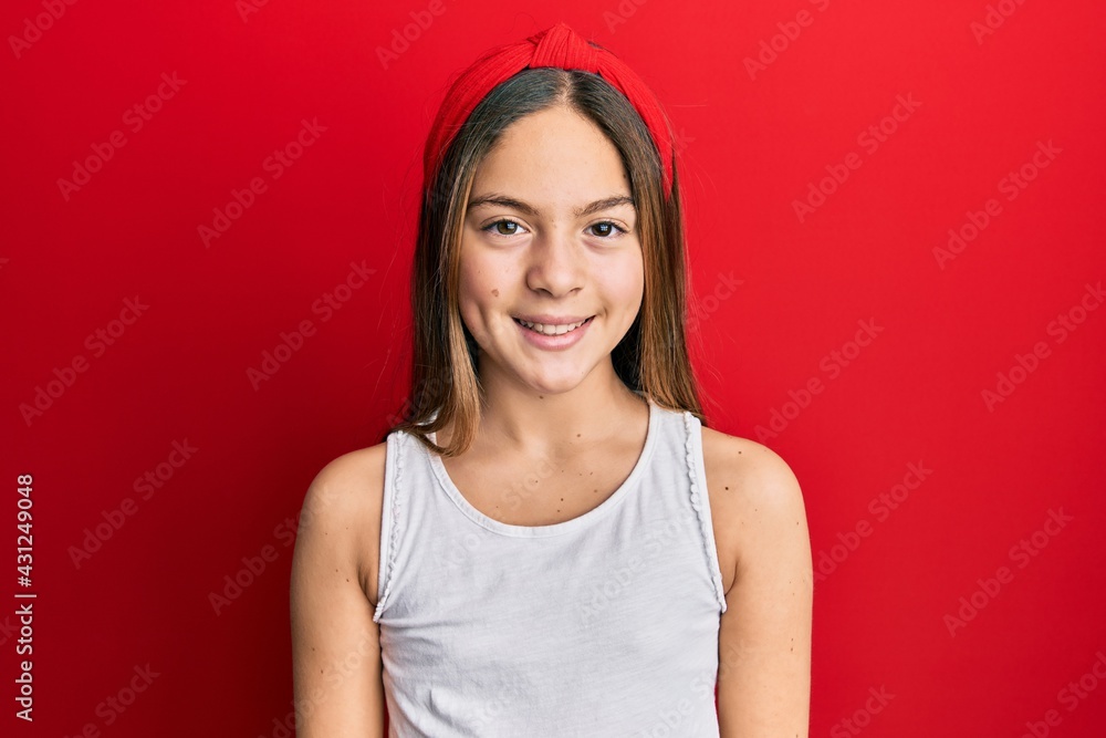Beautiful brunette little girl wearing casual white t shirt with a happy and cool smile on face. lucky person. Beautiful brunette little girl wearing casual white t shirt with a happy and cool smile on face. lucky person.