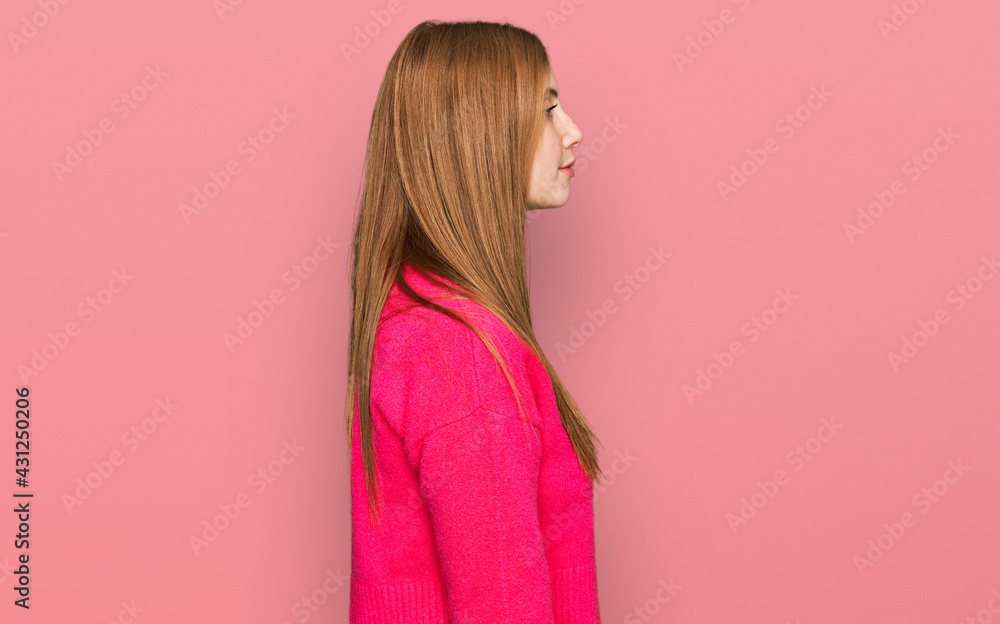 Young irish woman wearing casual clothes looking to side, relax profile pose with natural face with confident smile. Young irish woman wearing casual clothes looking to side, relax profile pose with natural face with confident smile.