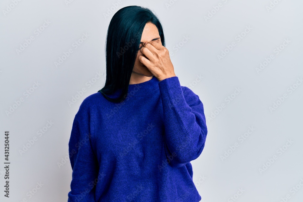 Young caucasian woman wearing casual clothes tired rubbing nose and eyes feeling fatigue and headache. stress and frustration concept. Young caucasian woman wearing casual clothes tired rubbing nose and eyes feeling fatigue and headache. stress and frustration concept.