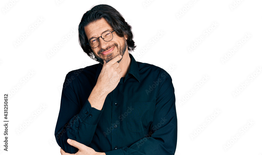 Middle age caucasian man wearing casual clothes and glasses looking confident at the camera with smile with crossed arms and hand raised on chin. thinking positive. Middle age caucasian man wearing casual clothes and glasses looking confident at the camera with smile with crossed arms and hand raised on chin. thinking positive.