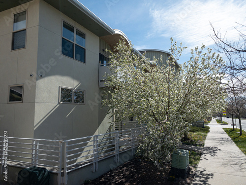 Regular street scene without people in a housing area with multiple units including condo or townhouse with balcony or veranda without people in Boulder, Colorado