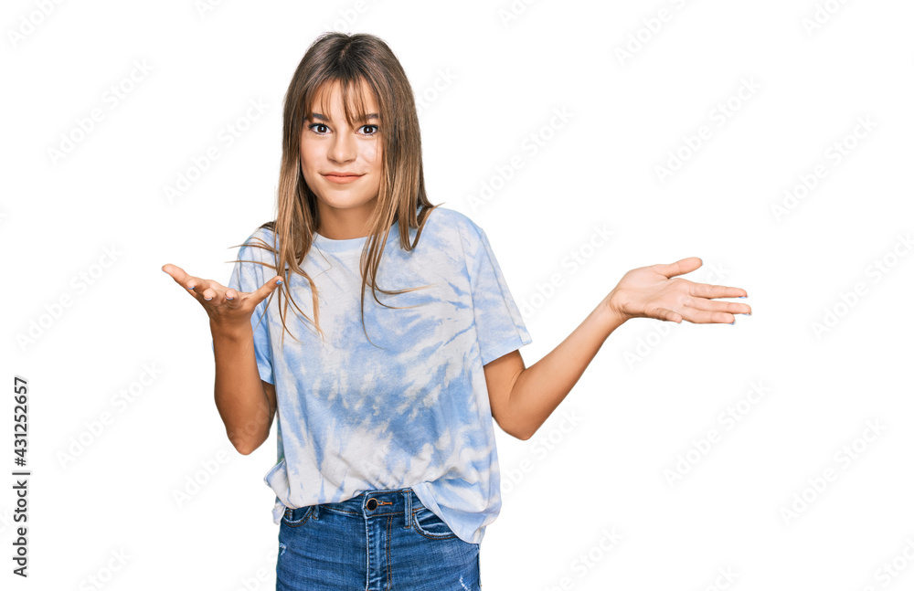 Teenager caucasian girl wearing casual clothes clueless and confused expression with arms and hands raised. doubt concept. Teenager caucasian girl wearing casual clothes clueless and confused expression with arms and hands raised. doubt concept.