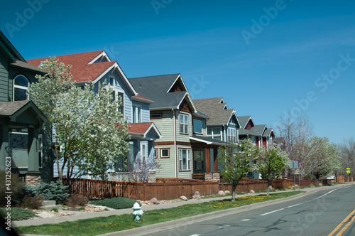 Regular street scene without people in a housing area with multiple units including condo or townhouse with balcony or veranda without people in Boulder, Colorado