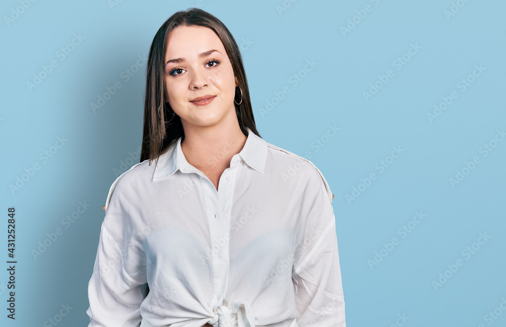 Young hispanic woman wearing casual clothes with a happy and cool smile on face. lucky person. Young hispanic woman wearing casual clothes with a happy and cool smile on face. lucky person.