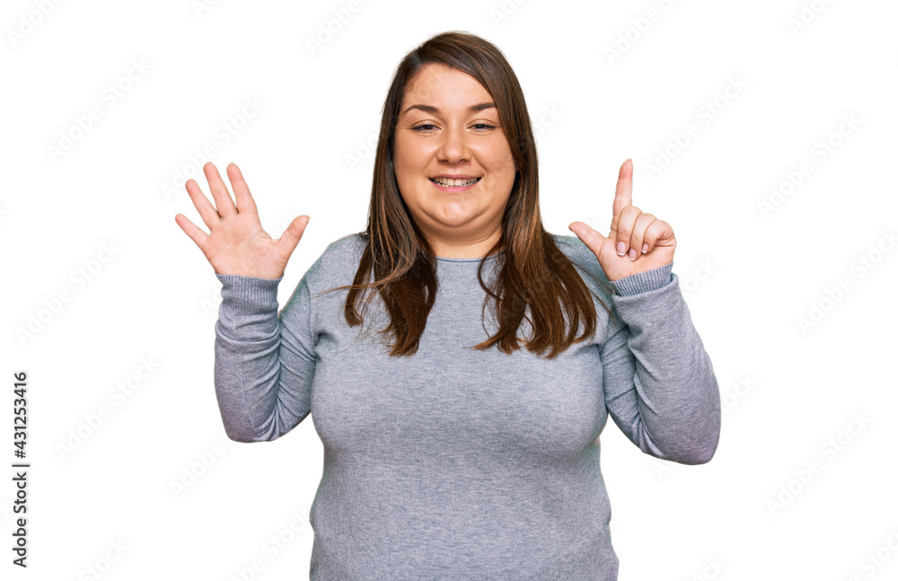 Beautiful brunette plus size woman wearing casual clothes showing and pointing up with fingers number seven while smiling confident and happy. Beautiful brunette plus size woman wearing casual clothes showing and pointing up with fingers number seven while smiling confident and happy.