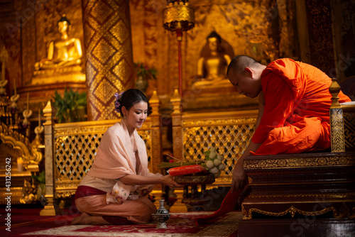 Making merit with monks It is one of the rituals of the Buddhist religion.