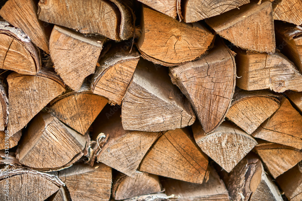 Firewood from the end. The logs lie together in the firebox. Pieces of wood together. Nature symbol. Cutting down trees. High quality photo Firewood from the end. The logs lie together in the firebox. Pieces of wood together. Nature symbol. Cutting down trees. High quality photo