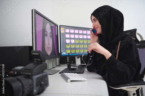 Muslim female graphic designer talking on the phone © .shock